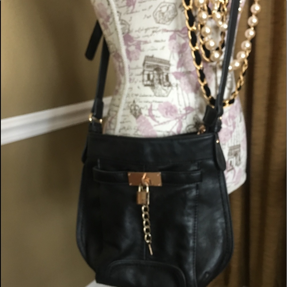 Black leather cross body purse gently used.